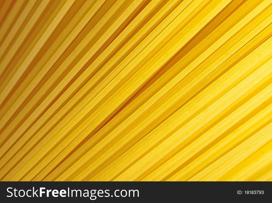 A bunch of spaghetti, uncooked spaghetti noodles background