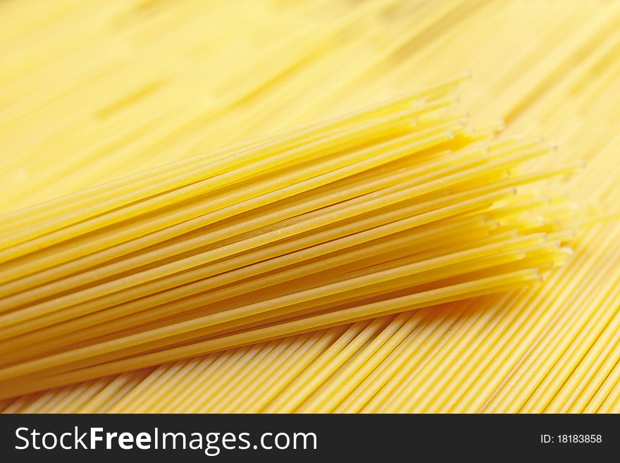 A bunch of spaghetti, uncooked spaghetti noodles background