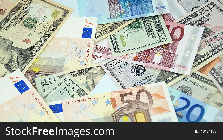 Background made from euro and dollar banknotes. Background made from euro and dollar banknotes