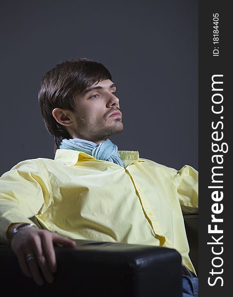 Proud man sitting in a leather chair. Proud man sitting in a leather chair