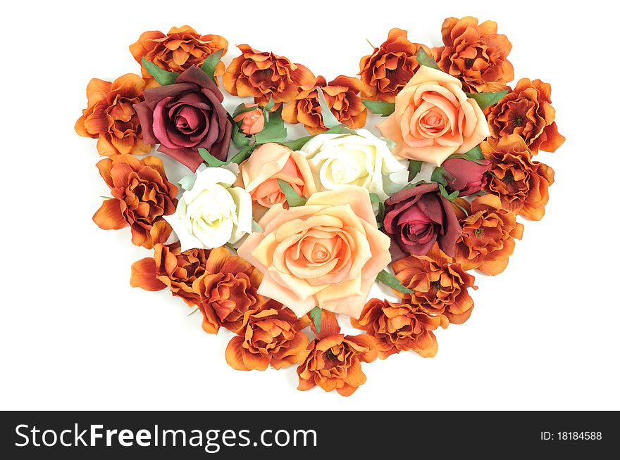 Batch of colorful roses in a heart shape on a white background. Batch of colorful roses in a heart shape on a white background
