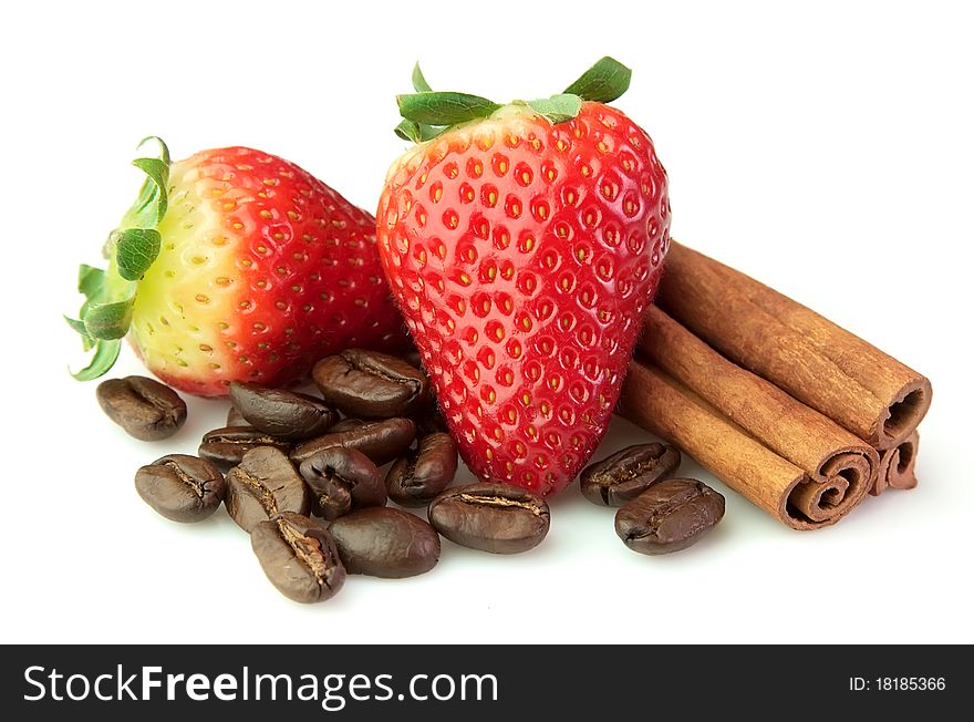 Strawberry with coffee and cinnamon rods on a white background. Strawberry with coffee and cinnamon rods on a white background
