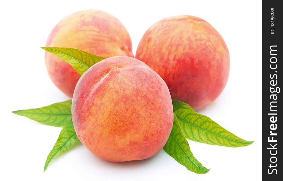 Ripe peaches on a white background