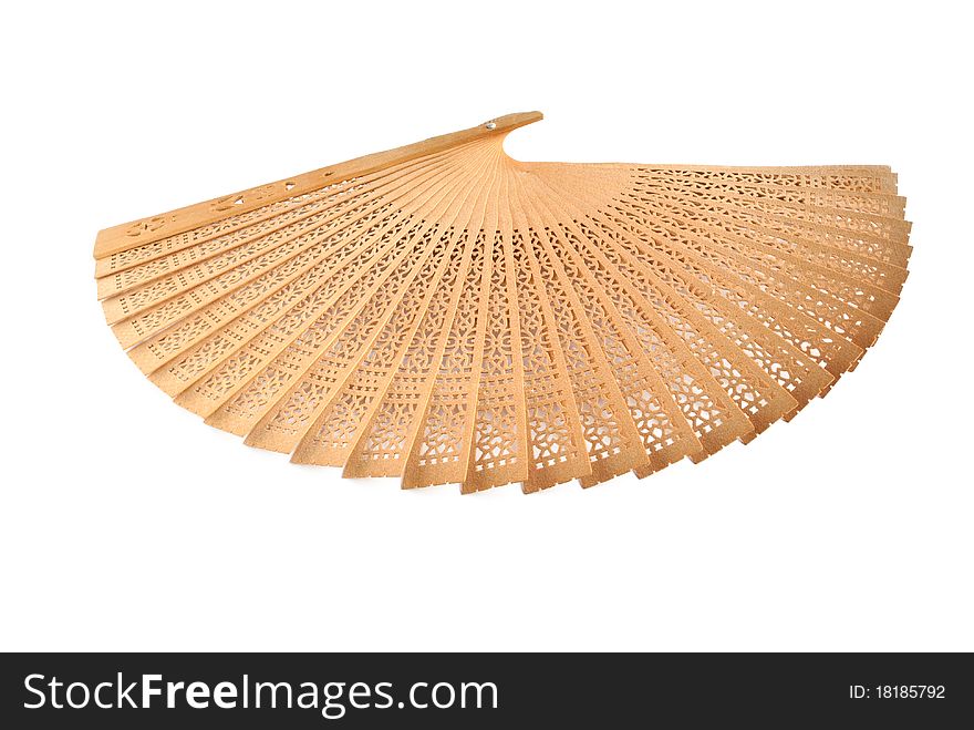 Decorative fan wooden openwork on a white background. Decorative fan wooden openwork on a white background