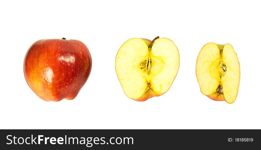 A whole apple, half and quartered apples isolated on a white background. A whole apple, half and quartered apples isolated on a white background.