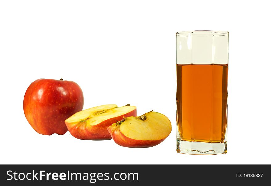 Whole, and slice an apple and a glass of juice isolated on a white background. Whole, and slice an apple and a glass of juice isolated on a white background.