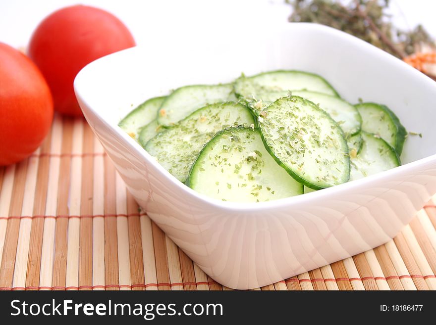 A fresh salad of cucumbers in a bowl