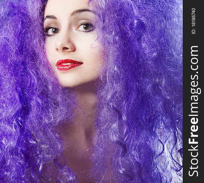 Beautiful young girl with bright violet hair. Beautiful young girl with bright violet hair