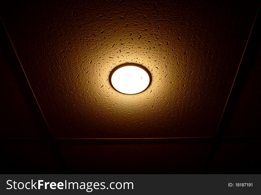 One lamp on the ceiling isolated on black