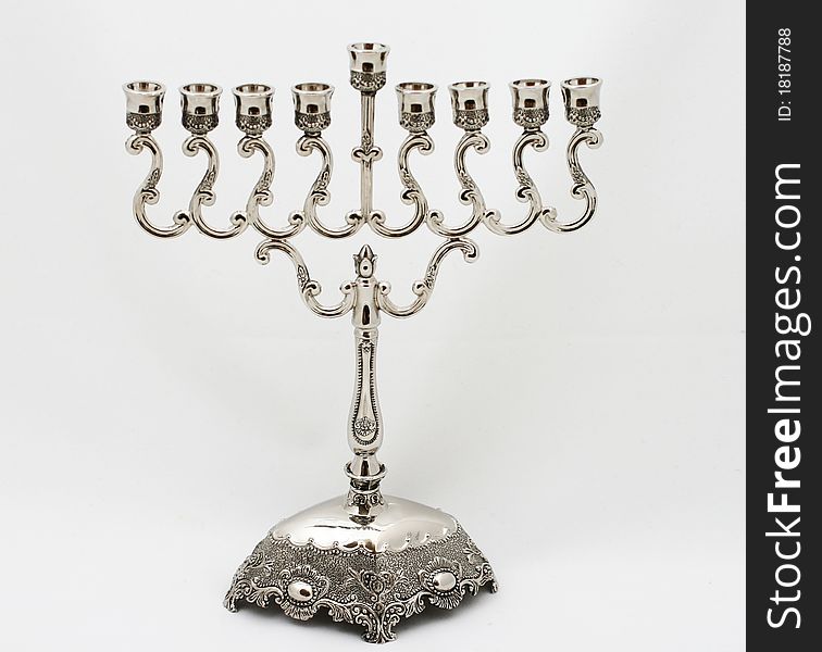 Menorah consists of 8 branches with an additional raised branch. Menorah consists of 8 branches with an additional raised branch
