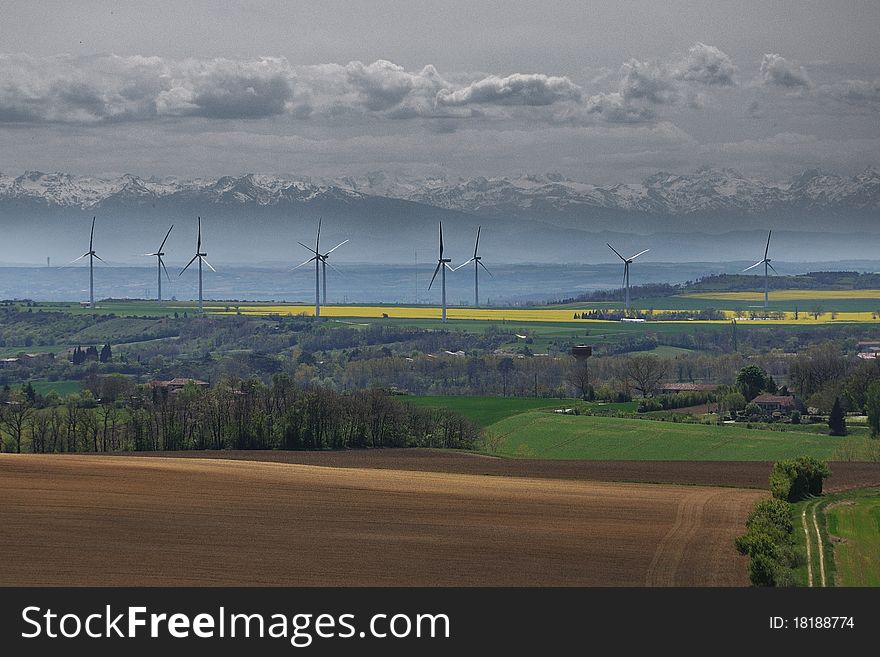 A wind park with the background of the pyrenees
