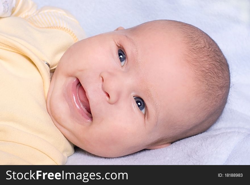 Photo of Portrait of cute newborn laughing. Photo of Portrait of cute newborn laughing