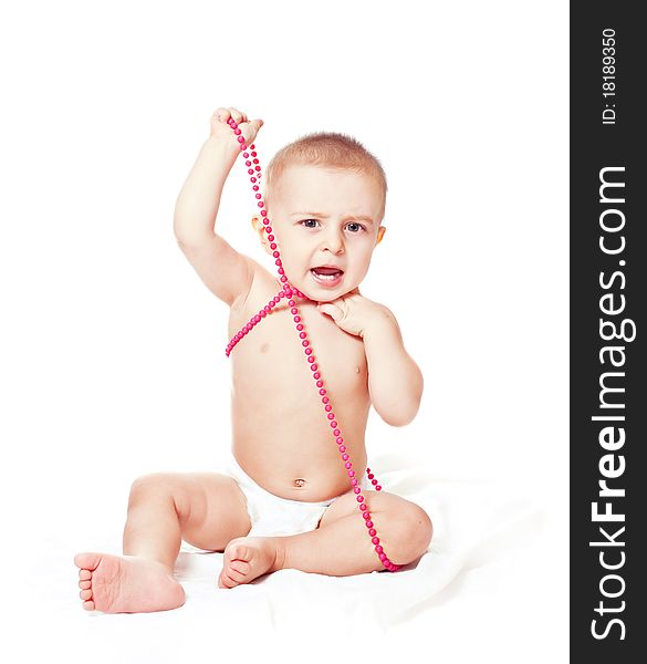 Baby boy with beads isolated on white