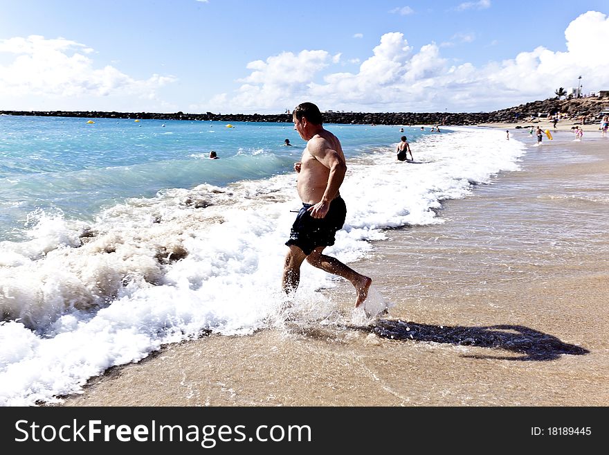 Man running at the beach