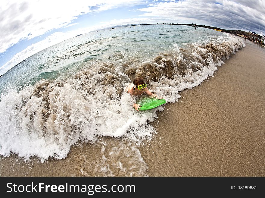 Boy Has Fun At The Beach