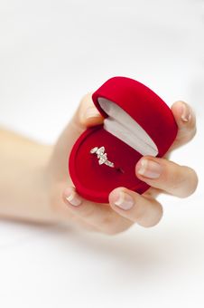 Red Box With Engagement Ring Inside Held In Hand Royalty Free Stock Photos