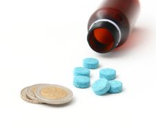 Medication And Coins Royalty Free Stock Photos