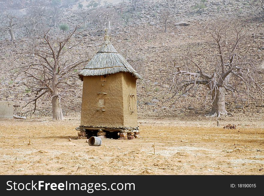 A Dogon granary with boab trees in the background. A Dogon granary with boab trees in the background