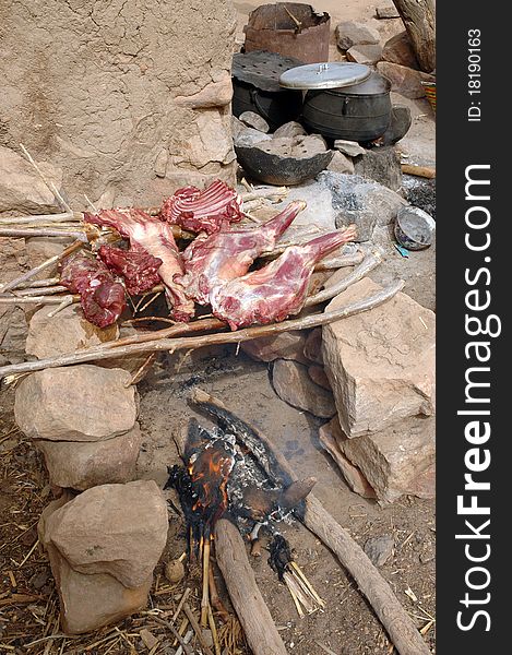 Goat cooking for a feast over a fire in a Dogon village in Mali. Goat cooking for a feast over a fire in a Dogon village in Mali