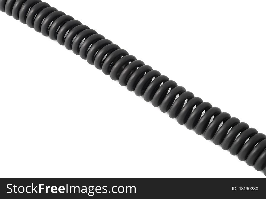 Black wire in the form of a spring. On a white background