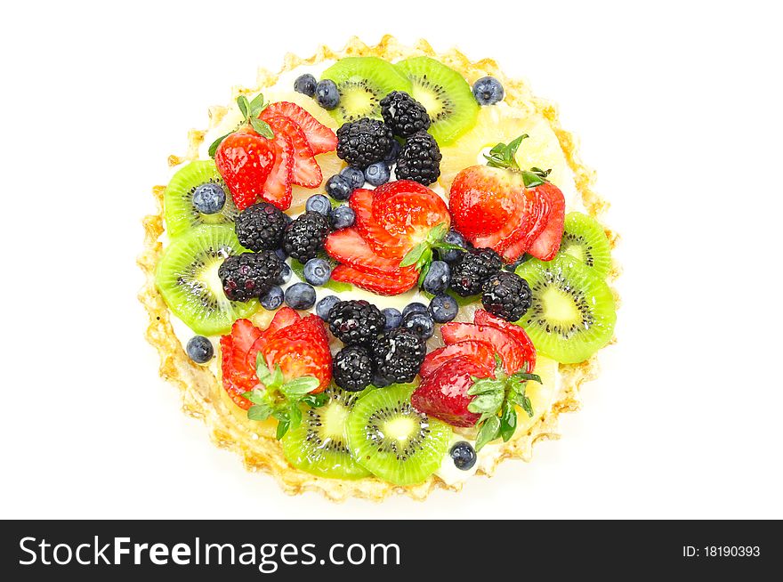 Tart with variety of fruit with cream on a white background. Tart with variety of fruit with cream on a white background