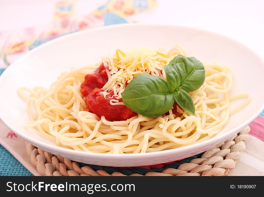 Spaghettis with tomatoes sauce on a plate