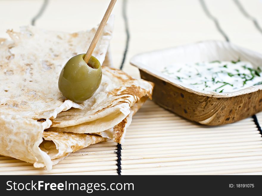 Wheat bread with olive and dip. Wheat bread with olive and dip.