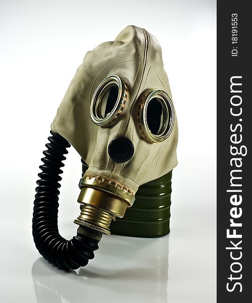 Old military gas mask on white background