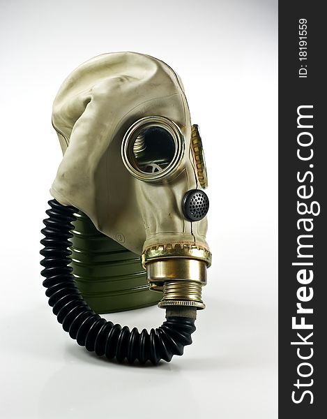 Old military gas mask on white background