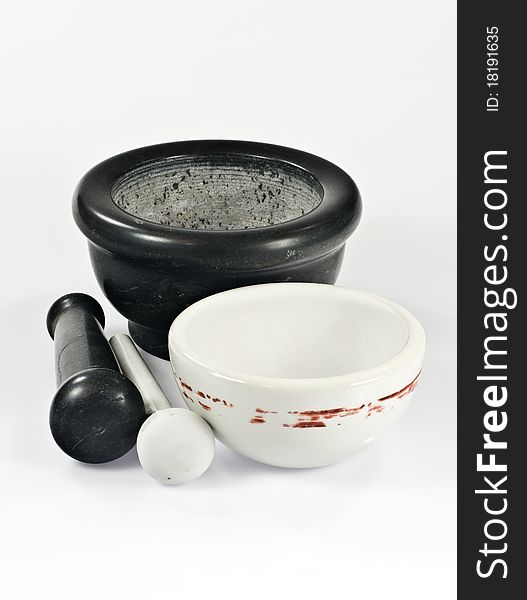 Two mortars with pestles on white background