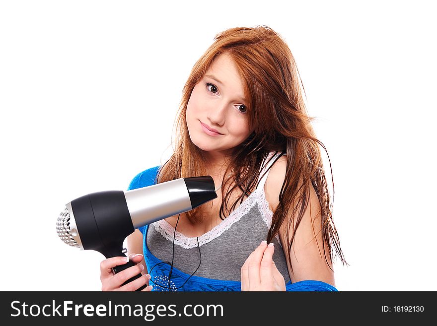 Young woman with fashion hairstyle holding hairdryer and listen to music. Young woman with fashion hairstyle holding hairdryer and listen to music