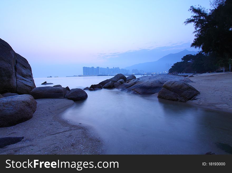 Sunset under long exposure along seashore