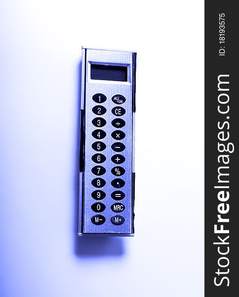 Calculator isolated, toned in blue.