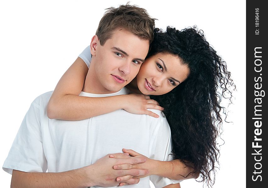 Young couple with a heart over white background