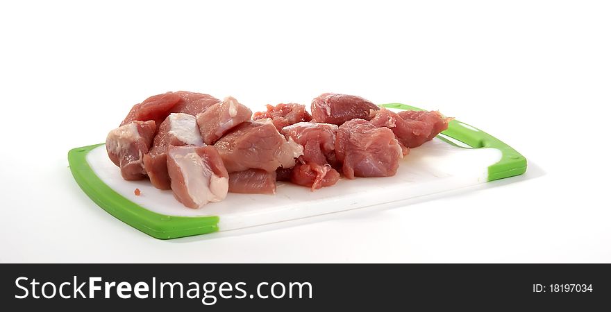 Fresh meat on a cutting board on a white background