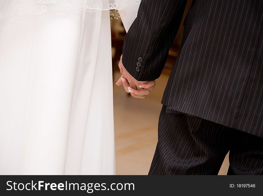 Bride and Groom Hand with Wedding Ring