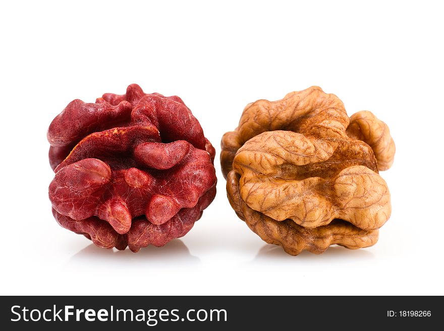 Red and Brown Walnuts on a white background