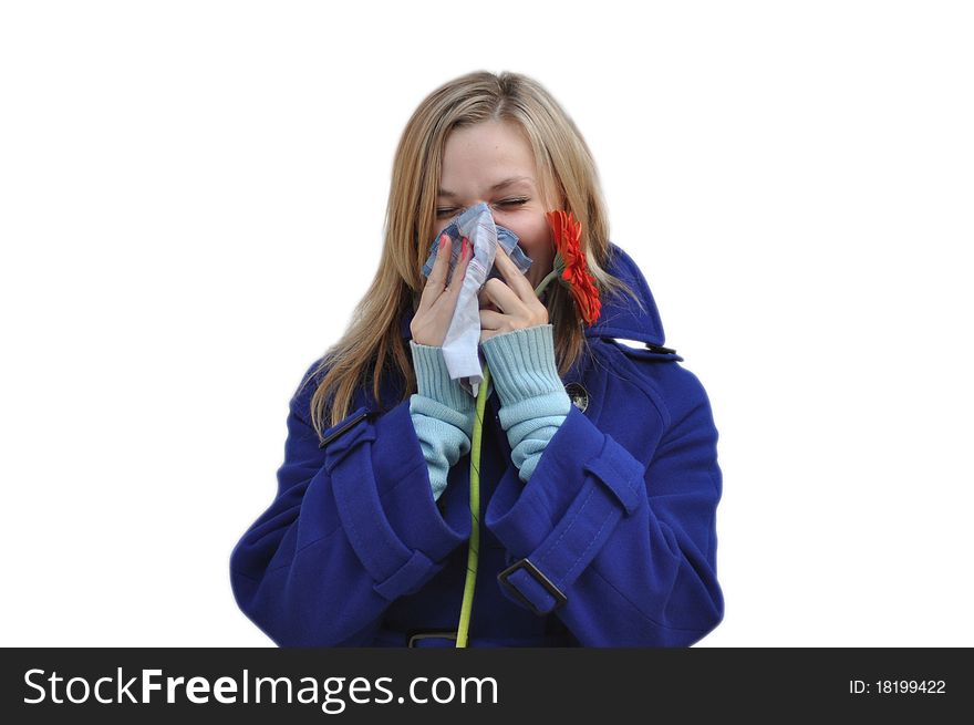 Isolate the image of a woman with a runny nose in a blue coat over a white background