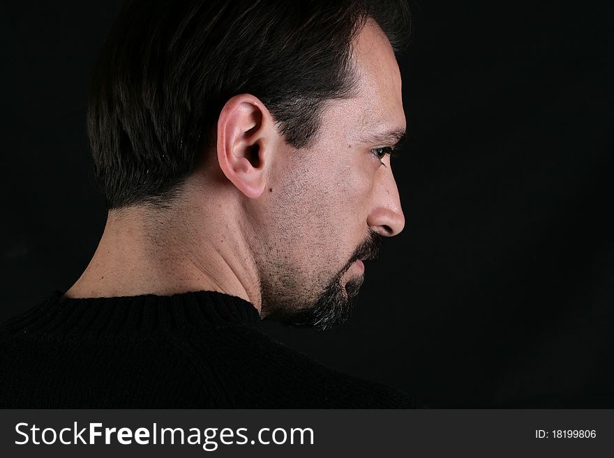 Portrait of a handsome young man on black background. Portrait of a handsome young man on black background