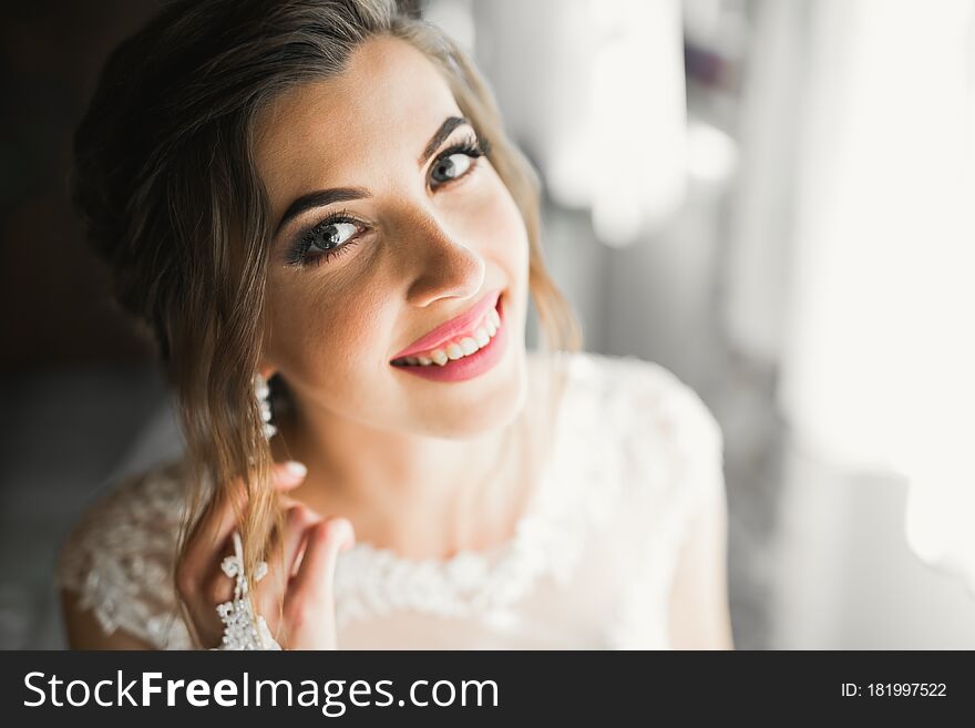 Luxury Bride In White Dress Posing While Preparing For The Wedding Ceremony