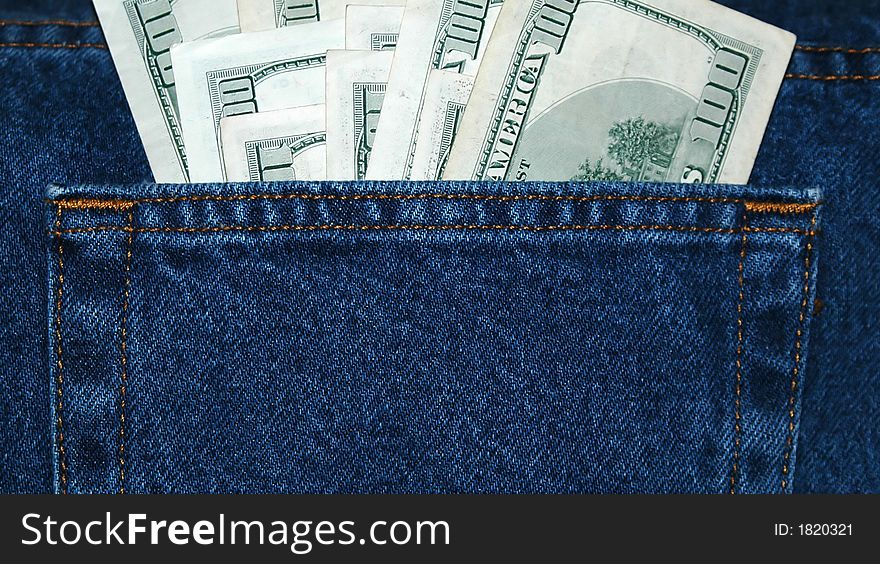 100 dollar bills in a jean pocket. 100 dollar bills in a jean pocket.