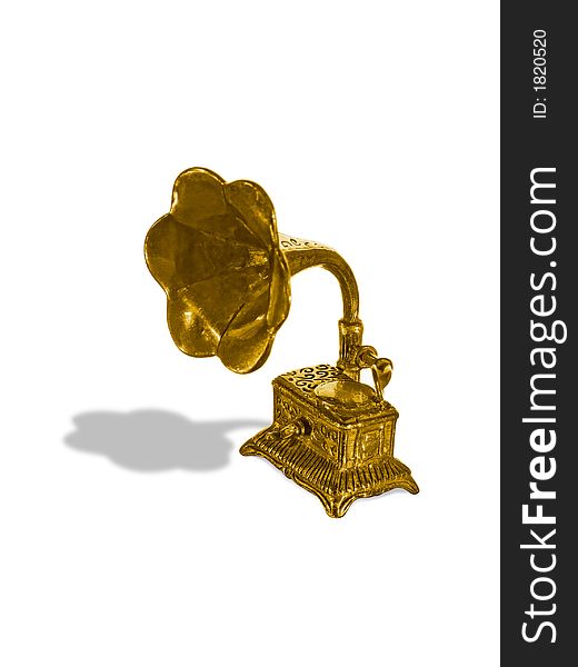 Gold old gramophone (figurine), isolated on white