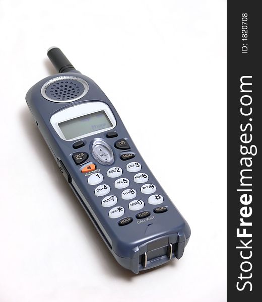 A cordless phone  in dark gray over white background. A cordless phone  in dark gray over white background.