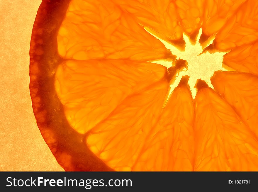 A close-up of an orange on orange background. A close-up of an orange on orange background.