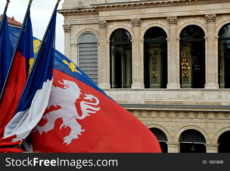 Lyon flag, with the opera building in the background. Lyon flag, with the opera building in the background