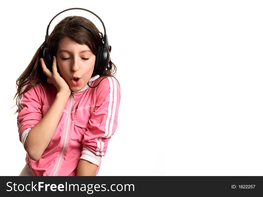 The girl listens to music in headphones