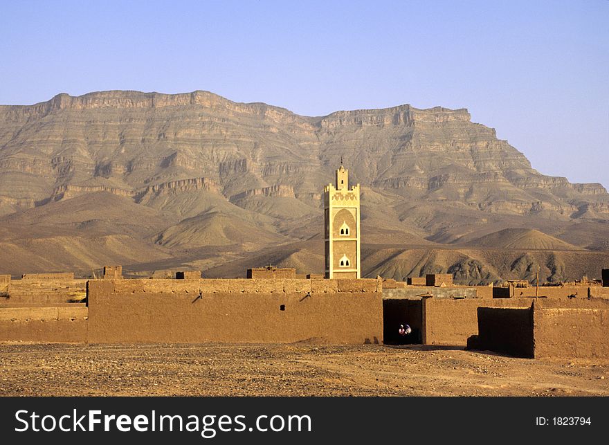 Fortified village with its mosque named ksar of Draa river valley in southern Morocco. Fortified village with its mosque named ksar of Draa river valley in southern Morocco