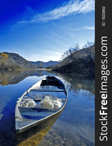 Lake bark for lake fishing and clear day with blue sky. Lake bark for lake fishing and clear day with blue sky.