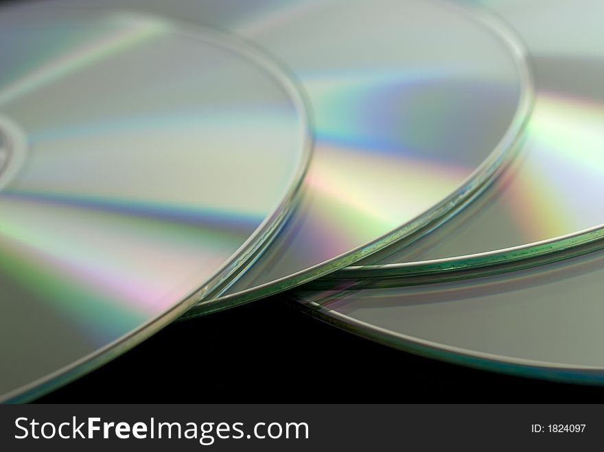 Closeup image of four CD disks. Closeup image of four CD disks.