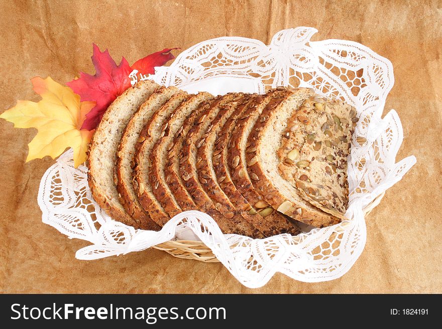 Bread and autumn leaves on a basket. Bread and autumn leaves on a basket